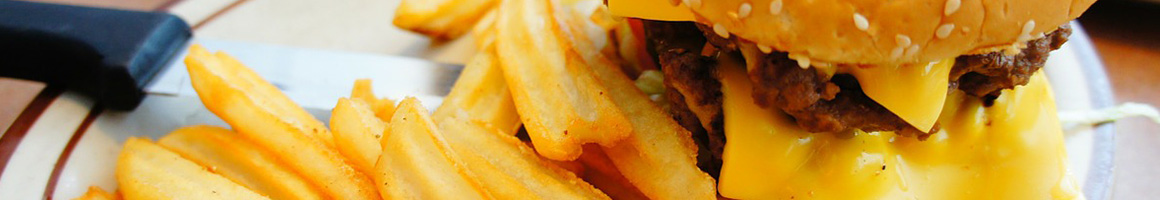 Eating Burger at Del's Charcoal Burgers restaurant in Richardson, TX.